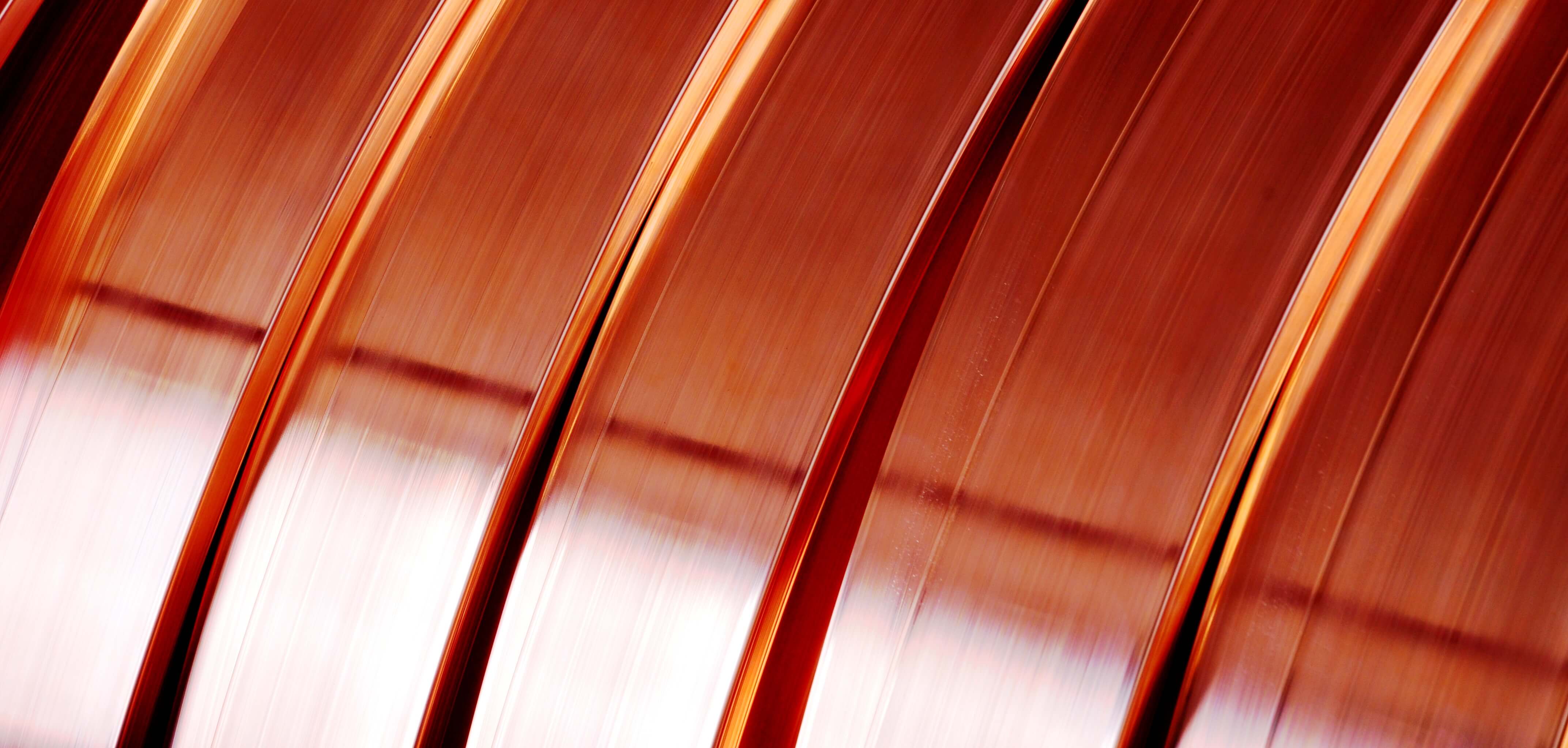 Close-up of polished copper strip coils